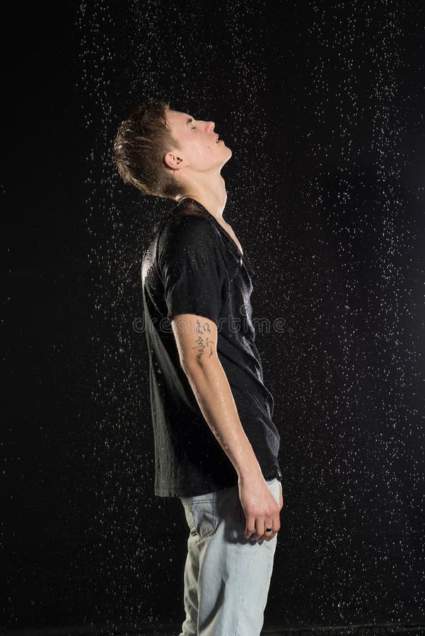 Young Attractive Man Standing Under Rain. Stock Image Image of