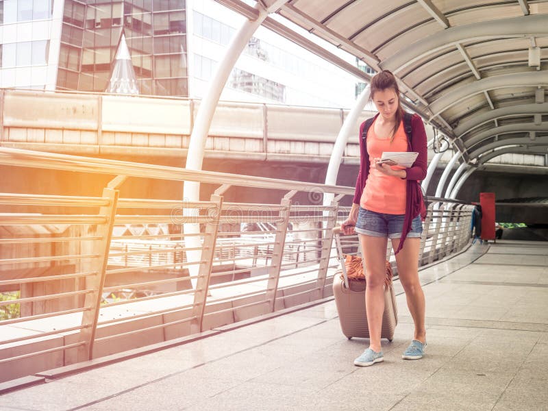 Young Attractive traveler woman in concept of tourism to travel, Travel or exploring concept stock photos Young Attractive traveler woman in concept of tourism to travel, Travel or exploring concept stock photos