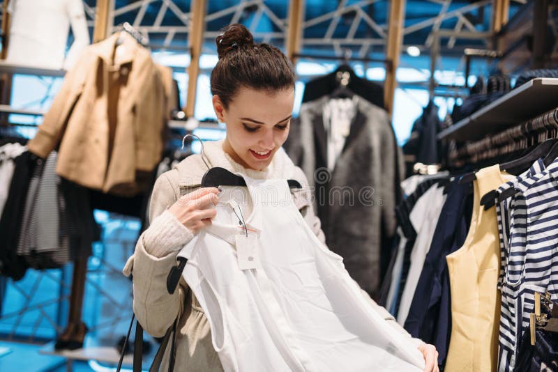 Young Attractive Woman Buying Clothes in Mall Stock Photo - Image of ...