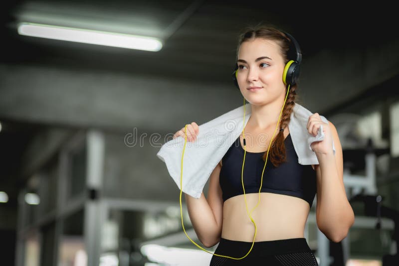 Young attractive woman caucasian sitting and listening to music by earphones connect to smart phone. stock photos Young attractive woman caucasian sitting and listening to music by earphones connect to smart phone. stock photos