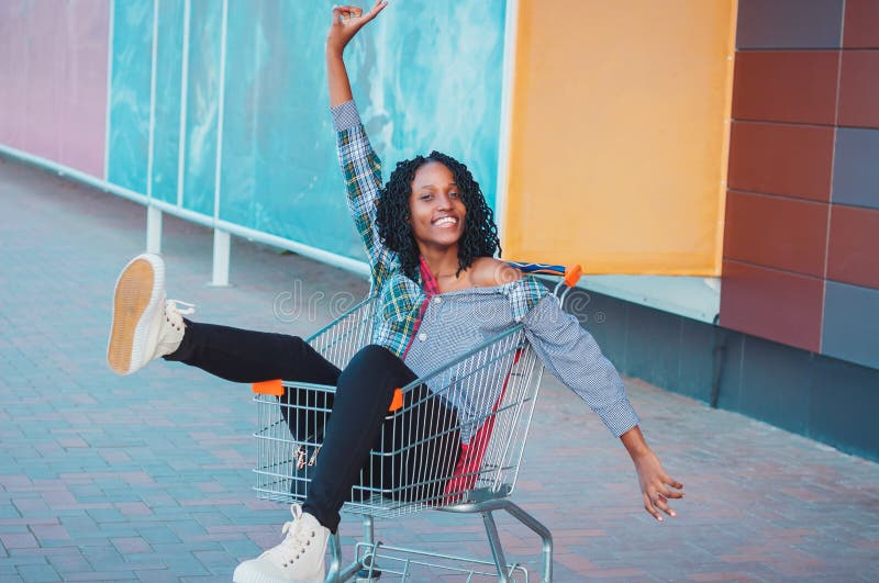 Young Beautiful Woman Dressed in Casual Clothes with a Shopping Cart ...