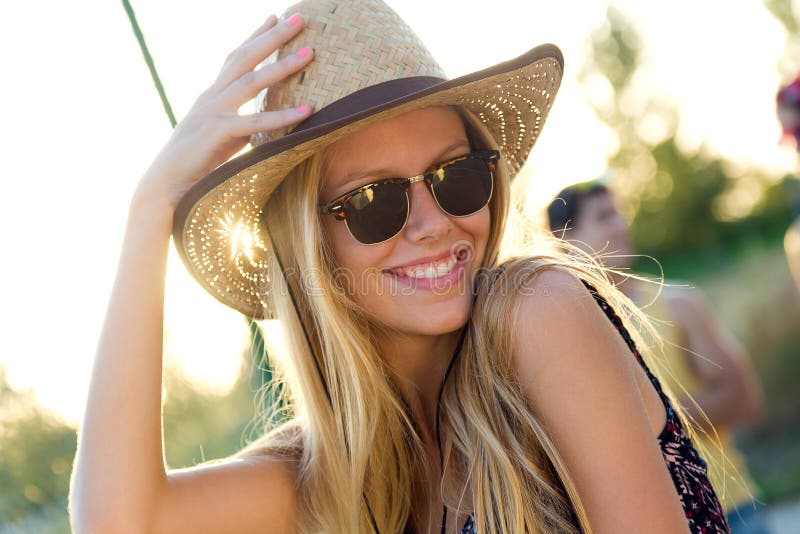 Young attractive woman with hat on a summer day.