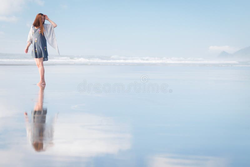 Young attractive woman posing at amazing New Zealand beach