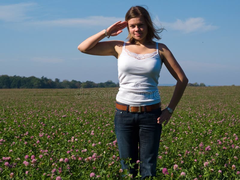 Young attractive woman saluting Yes Sir!