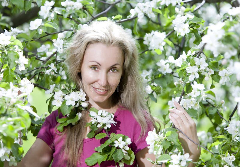 Young Attractive Woman Standing Near The Blossoming Apple Tree Stock Image Image Of Long