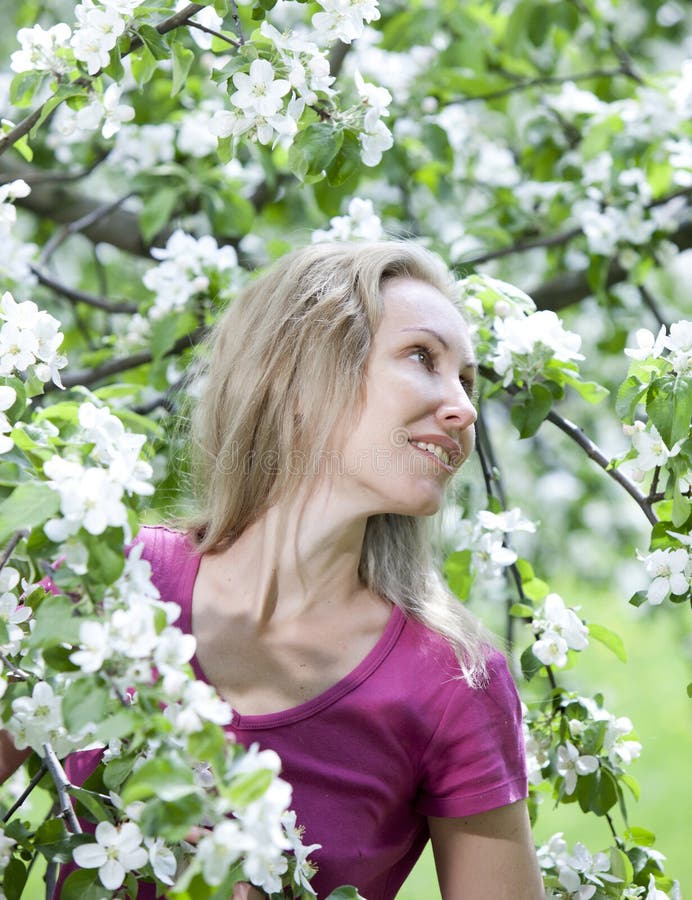 Young Attractive Woman Standing Near The Blossoming Apple Tree Stock Image Image Of Attractive