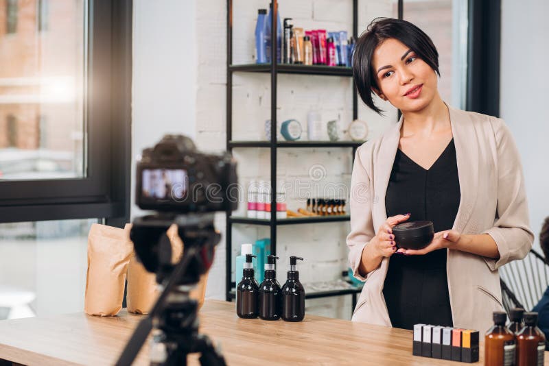 Young awesome woman presenting a new cream stock photography Young awesome woman presenting a new cream stock photography