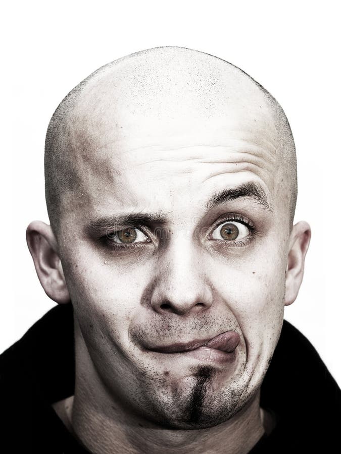 Young bald head teenager makes grimace stock image