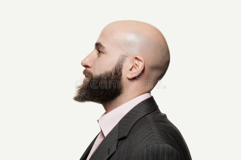 Young bald man with a beard stock photo