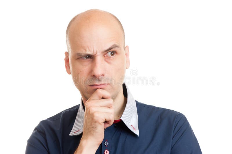 Young bald man doubting royalty free stock photography