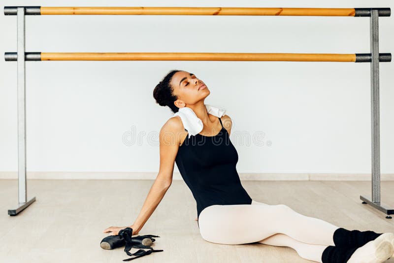 Young ballerina resting after dance training