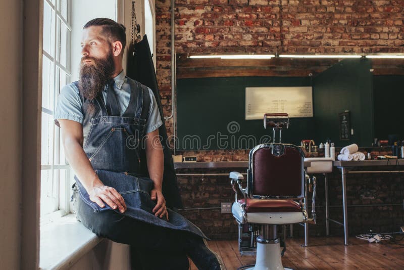 Young Barber at His Barbershop Stock Photo - Image of business, male ...