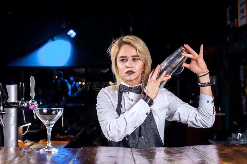 Charismatic Woman Bartending Demonstrates the Process of Making a ...