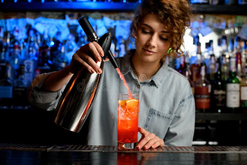 Young Bartender Woman Carefully Pouring Cocktail Using Steel Siphon ...