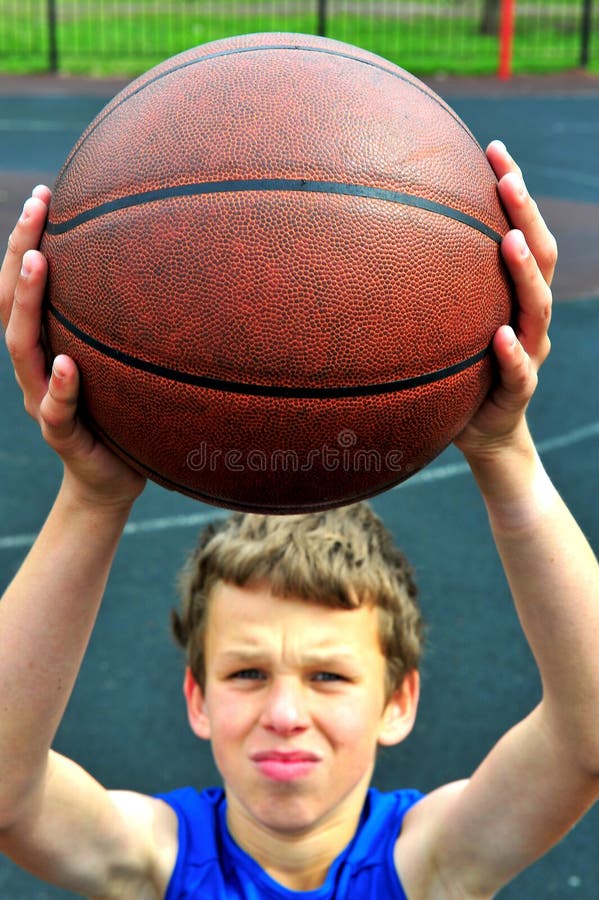 Young basketball player preparing to throw ball