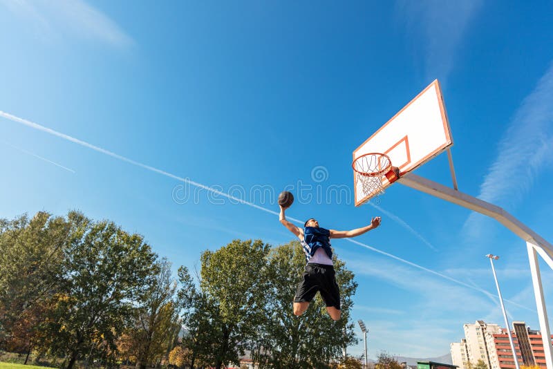 Young Basketball Street Player Making Slam Dunk Stock Photo Image of basket, athletic 113117650