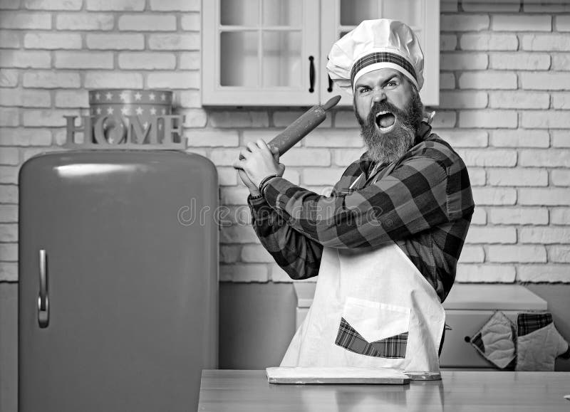 Young Bearded Chef Angry or Banging on Someone on Kitchen. Stock Image ...