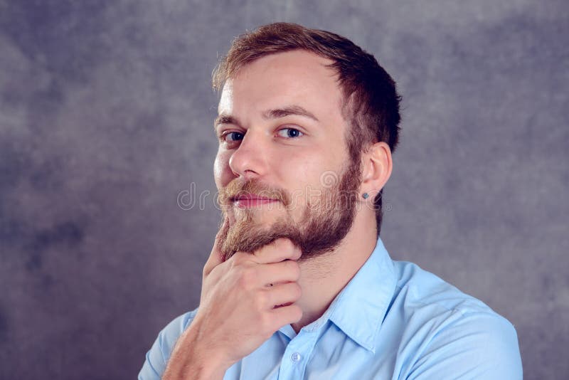 Young Bearded Man Is Reflecting Stock Photo - Image of bearded ...