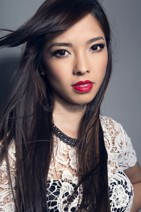 Young Beautiful Asian Woman with Flawless Skin and Perfect Make-up and ...