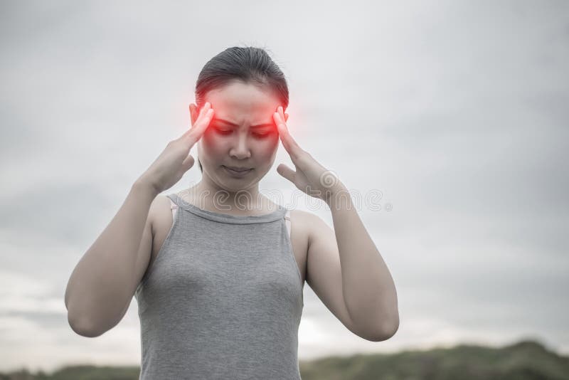 Young beautiful asian woman headache.