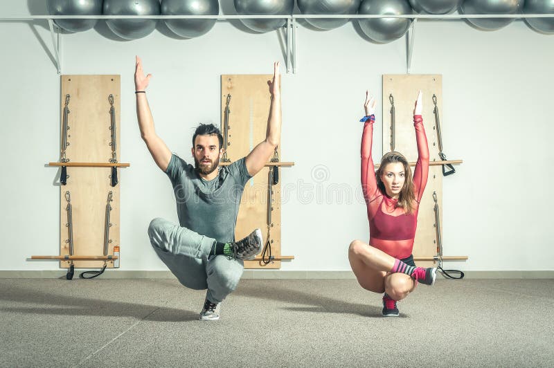 Young Yoga Fitness Acrobatic Couple Having Fun in the Gym Performing and Practicing  Funny Acrobat Selective Focus with Motion Blur Stock Image - Image of  healthy, male: 141486055
