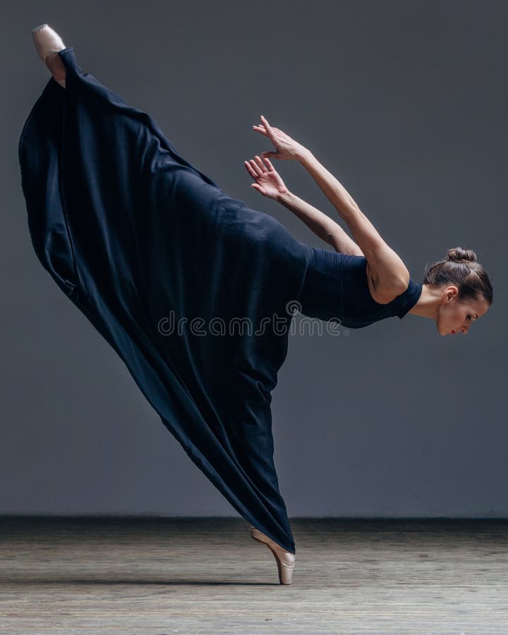 Young beautiful ballerina posing in studio stock photography