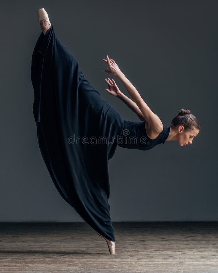 Young beautiful ballerina posing in studio royalty free stock photography