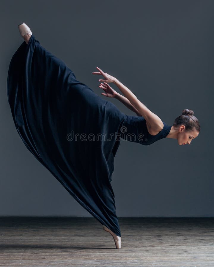 Young beautiful ballerina posing in studio stock image