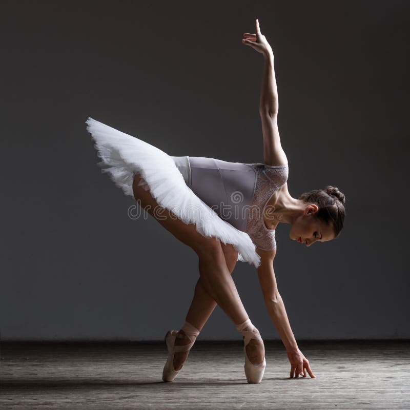 Young beautiful ballerina posing in studio stock photography