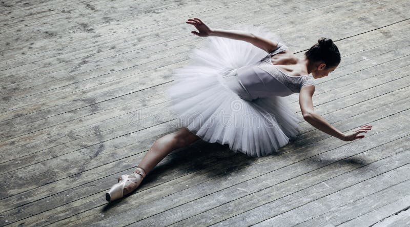 Young beautiful ballerina posing in studio royalty free stock photo