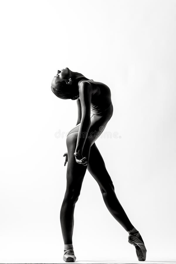 Young beautiful ballerina posing in studio stock photos