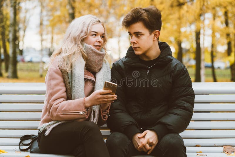 The boy looks tenderly at girl and wants to kiss. Concept of teenage love  and first kiss 7542624 Stock Photo at Vecteezy