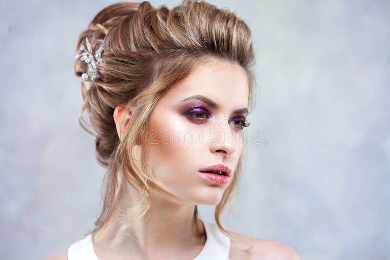 Young Beautiful Bride with an Elegant High Hairdo. Wedding Hairstyle with  the Accessory in Her Hair Stock Image - Image of bride, hairstyle: 115533183