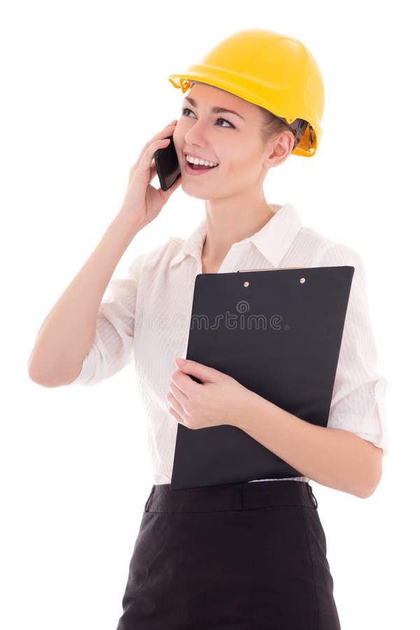 young beautiful business woman architect in builder helmet talking by phone isolated on white