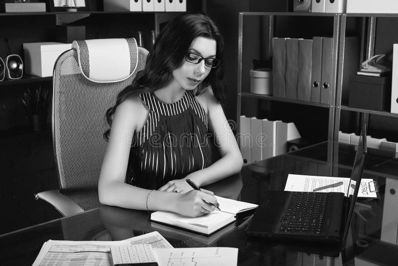 Young Beautiful Business Woman Working at Stylish Black Desk Stock ...