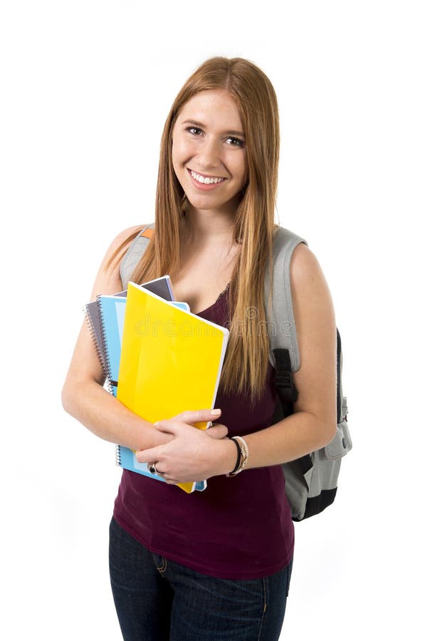 Young beautiful college student girl carrying backpack and books posing happy and confident in university education concept