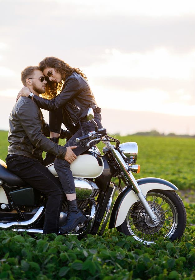Couples posing on Royal Enfield bike - PixaHive