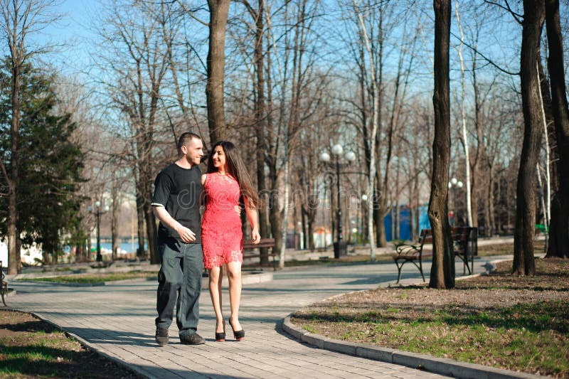 Young beautiful couple in love posing outdoor in city. Young woman smiling with her handsome man. royalty free stock photography Young beautiful couple in love posing outdoor in city. Young woman smiling with her handsome man. royalty free stock photography