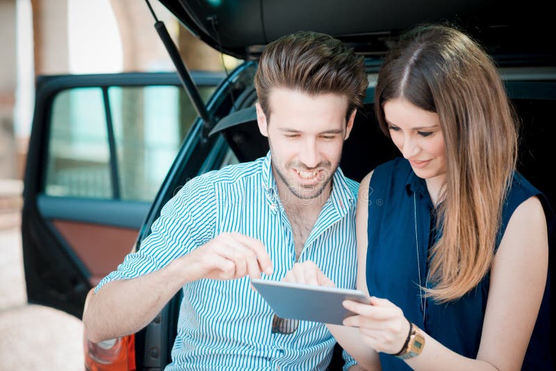 Young beautiful couple lovers using tablet