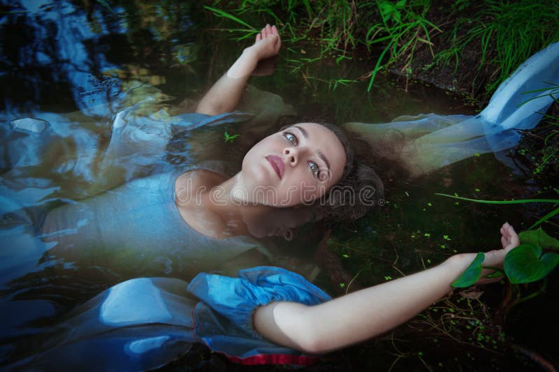 Young Beautiful Drowned Woman in Blue Dress Lying in the Water Stock ...