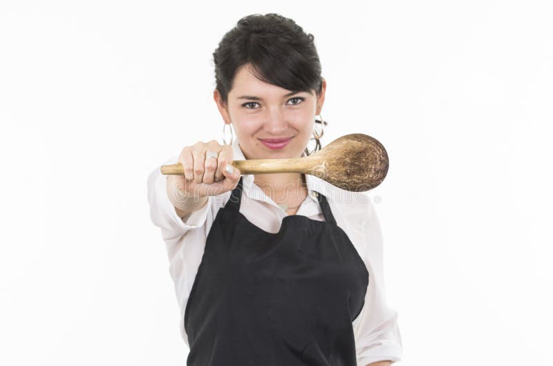 Young beautiful female chef wearing black apron