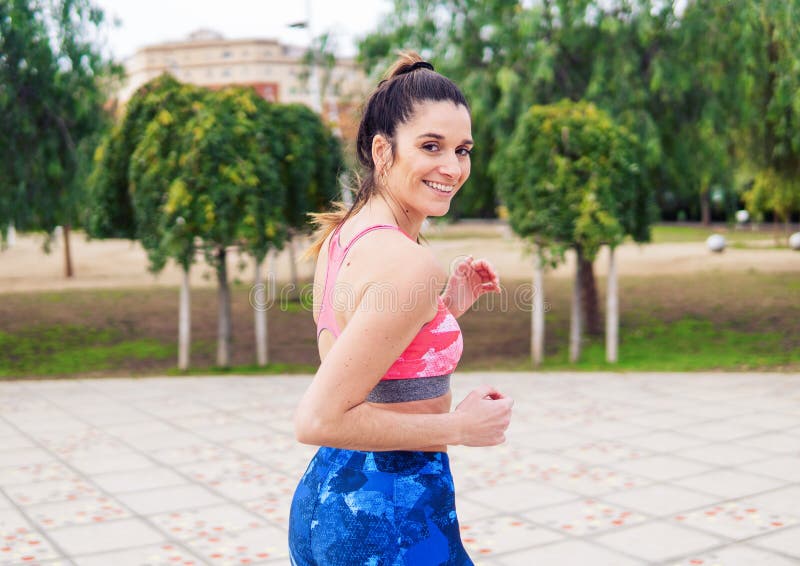 Young Beautiful Fit Woman is Running in the Park Stock Image - Image of ...