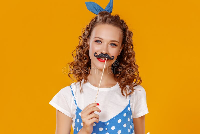 beautiful funny girl with moustache on colored yellow background stock photography beautiful funny girl with moustache on colored yellow background stock photography