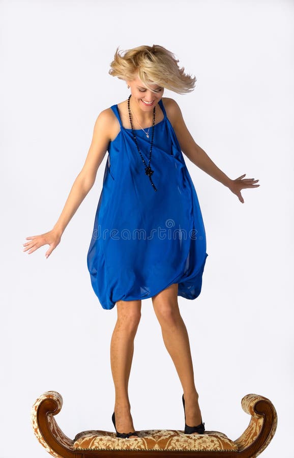 Young beautiful girl in blue dress