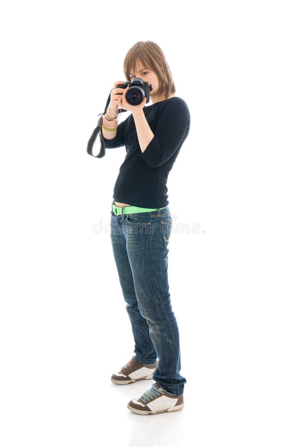 The young beautiful girl with the camera isolated