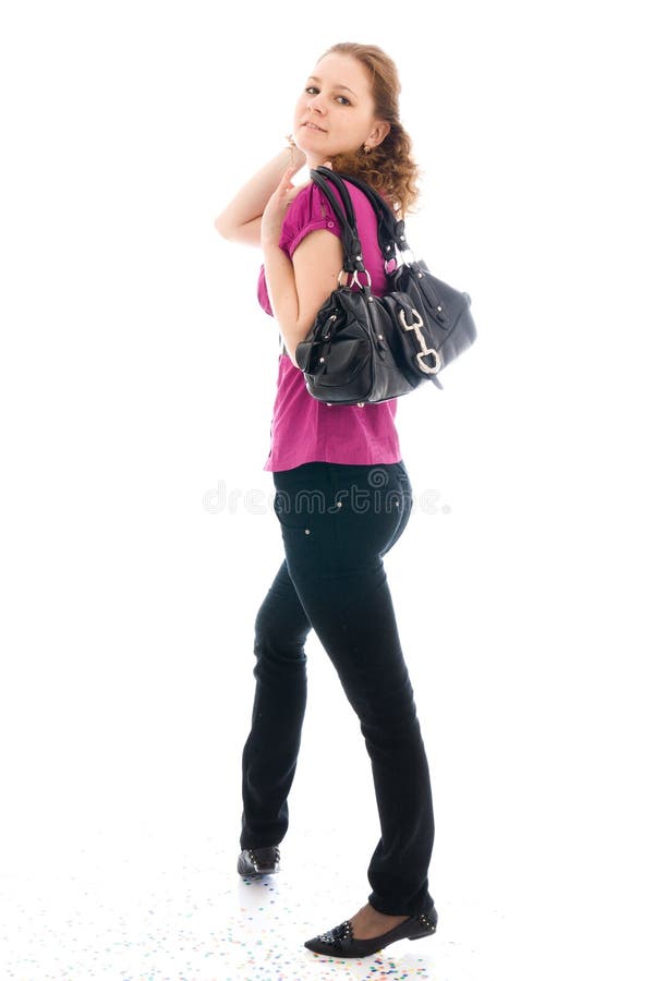 The young beautiful girl with a handbag isolated