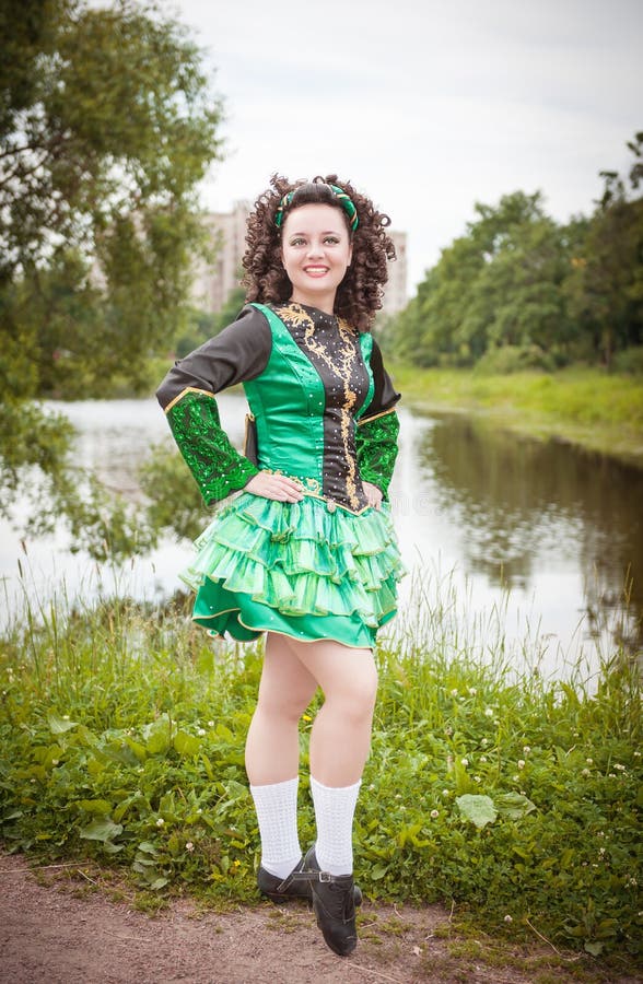Young Beautiful Girl In Irish Dance Dress And Wig Posing 