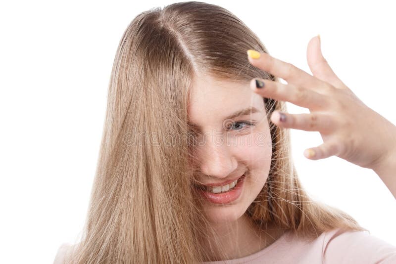 Young girl looks at an electrified hair