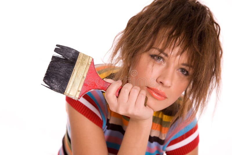 Young beautiful girl with paint brush