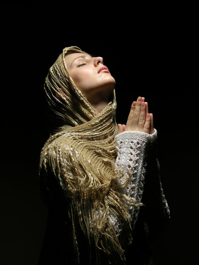 Young and beautiful girl praying.  royalty free stock images